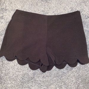 Scalloped edge black shorts